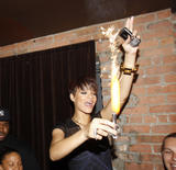 Rihanna shows legs and cleavage in sheer black dress at Good Girl Gone Bad Screening Party in New York